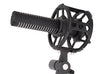 This is a picture of the Sanken CS-M1 shotgun microphone. It is being held up at a side angle position by a piece of equipment. It is black in colour. 